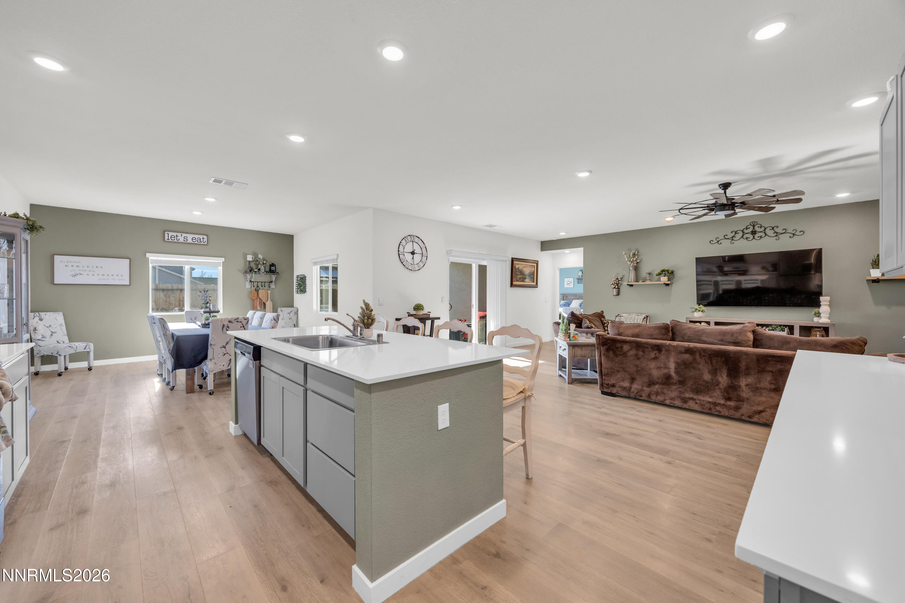 737 Butte Crk Road Dayton, NV 89403 - Photo 5 of 34 a large living room with stainless steel appliances granite countertop a couch and a flat screen tv
