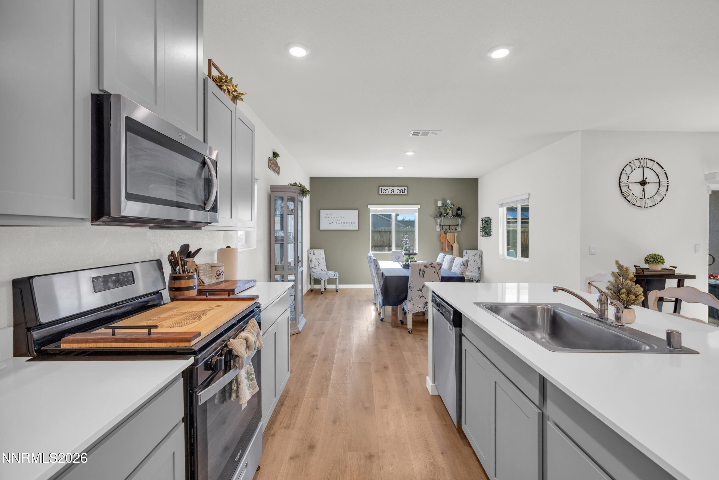 737 Butte Crk Road Dayton, NV 89403 - Photo 7 of 34 a kitchen with a sink stove and cabinets