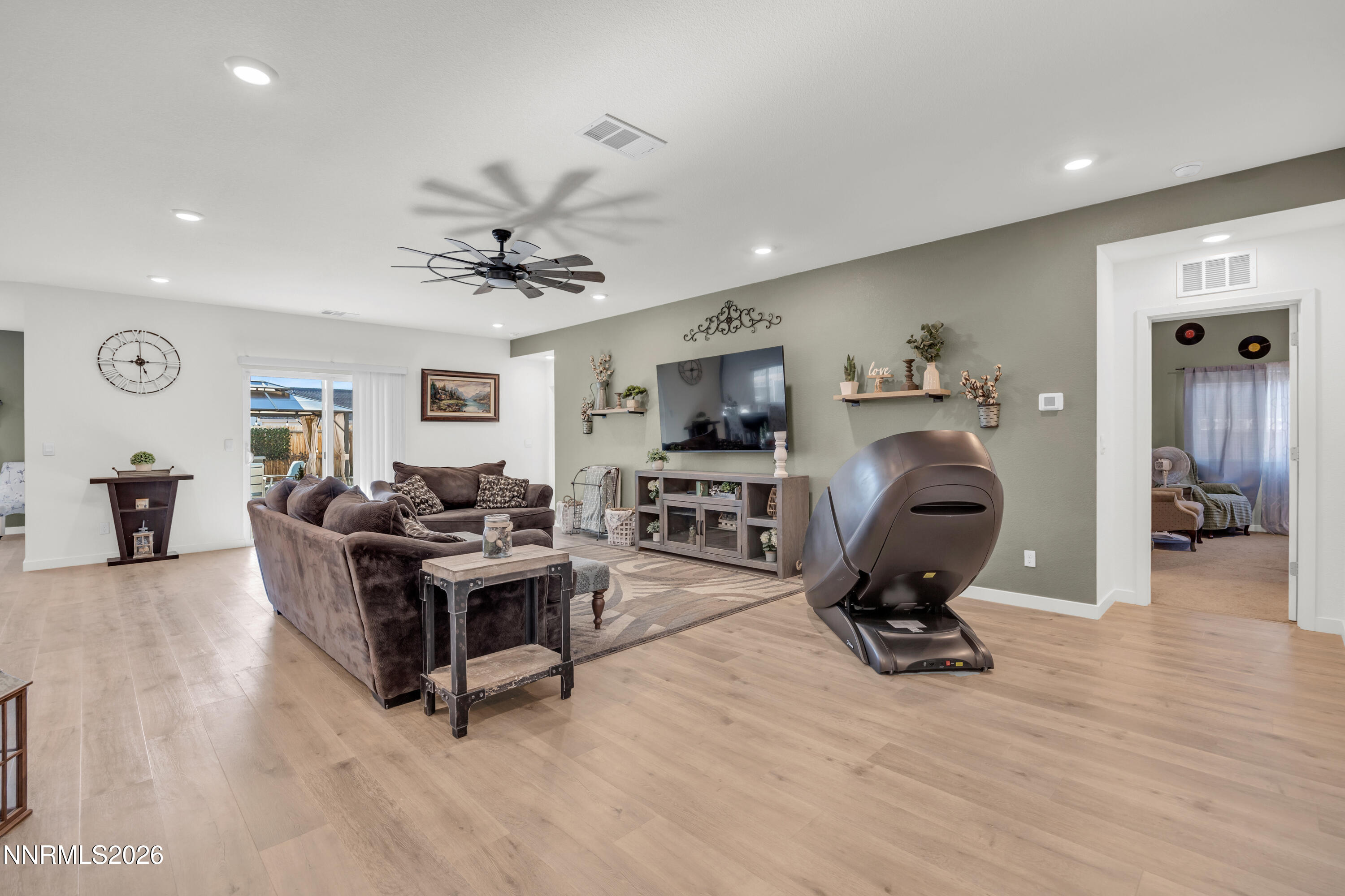 737 Butte Crk Road Dayton, NV 89403 - Photo 9 of 34 a living room with furniture gym equipment and a flat screen tv