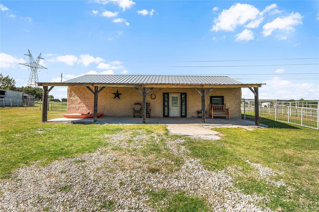748 Rocky Ridge Lane Weatherford, TX 76085 - Photo 28 of 38 a view of a house with a backyard