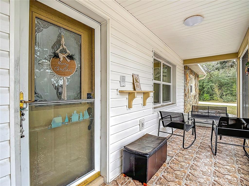 9171 Vicksburg Road Spring Hill, FL 34608 - Photo 2 of 55 a living room with furniture and a window