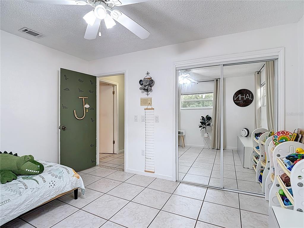 9171 Vicksburg Road Spring Hill, FL 34608 - Photo 27 of 55 a view of livingroom with furniture and ceiling fan