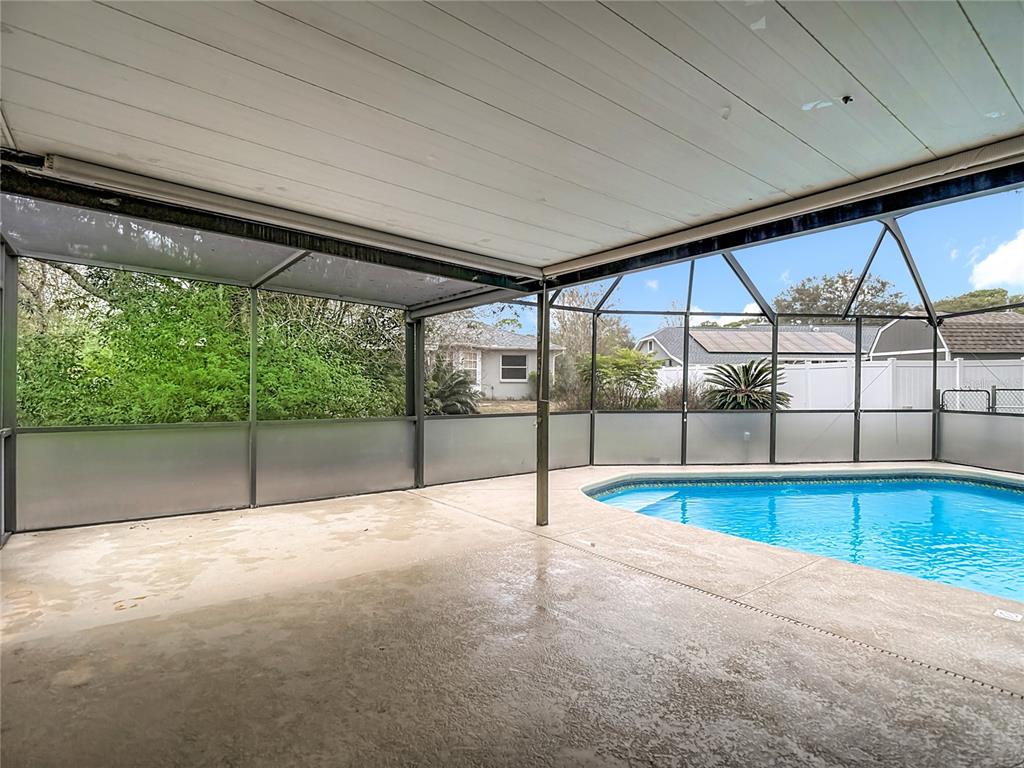 9171 Vicksburg Road Spring Hill, FL 34608 - Photo 31 of 55 a view of empty room with floor to ceiling window