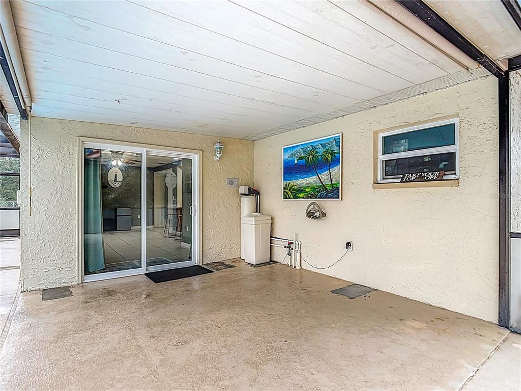 9171 Vicksburg Road Spring Hill, FL 34608 - Photo 33 of 55 a view of a livingroom with wooden floor and window