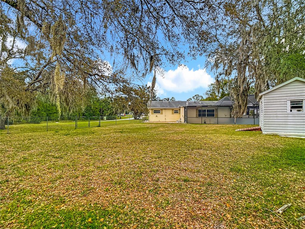 9171 Vicksburg Road Spring Hill, FL 34608 - Photo 39 of 55 a front view of a house with a yard