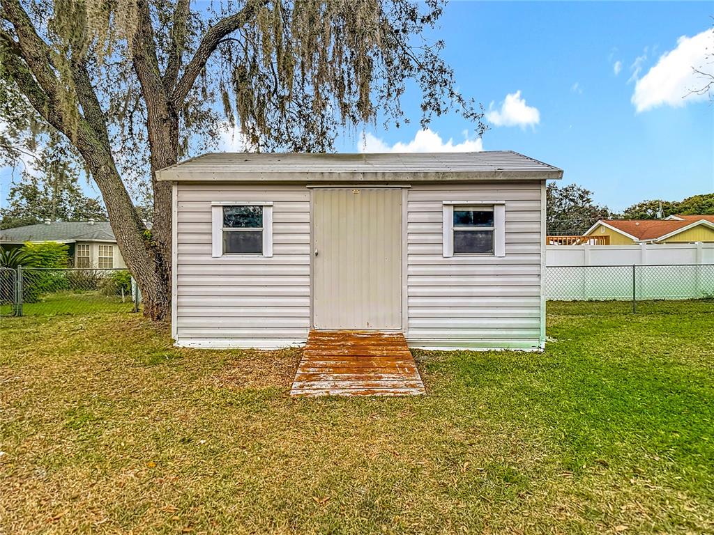 9171 Vicksburg Road Spring Hill, FL 34608 - Photo 40 of 55 a view of backyard of house with green space