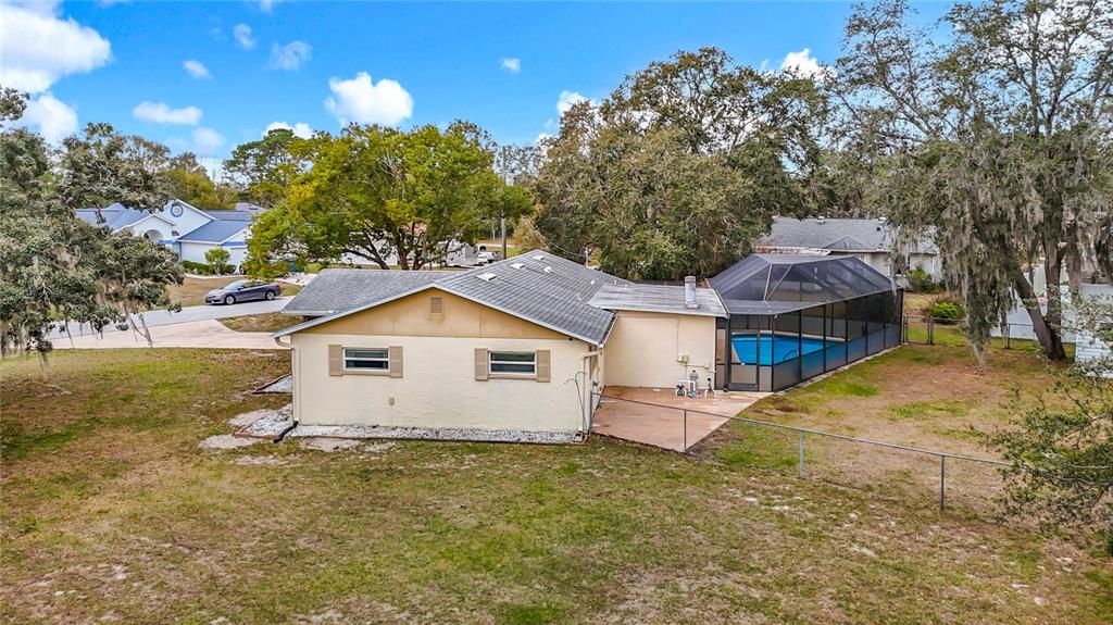 9171 Vicksburg Road Spring Hill, FL 34608 - Photo 42 of 55 a front view of a house with a yard