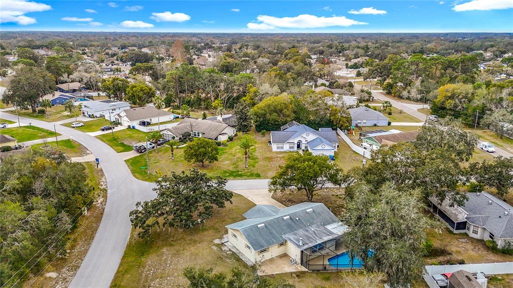 9171 Vicksburg Road Spring Hill, FL 34608 - Photo 46 of 55 an aerial view of residential houses with outdoor space