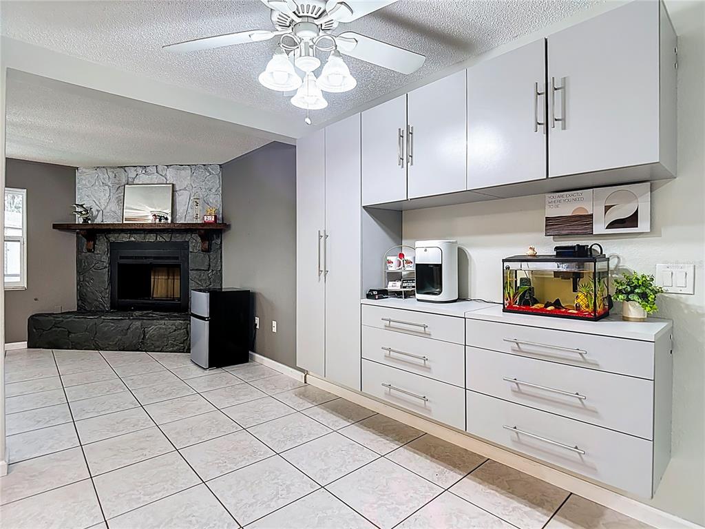 9171 Vicksburg Road Spring Hill, FL 34608 - Photo 6 of 55 a kitchen with a cabinets and chandelier