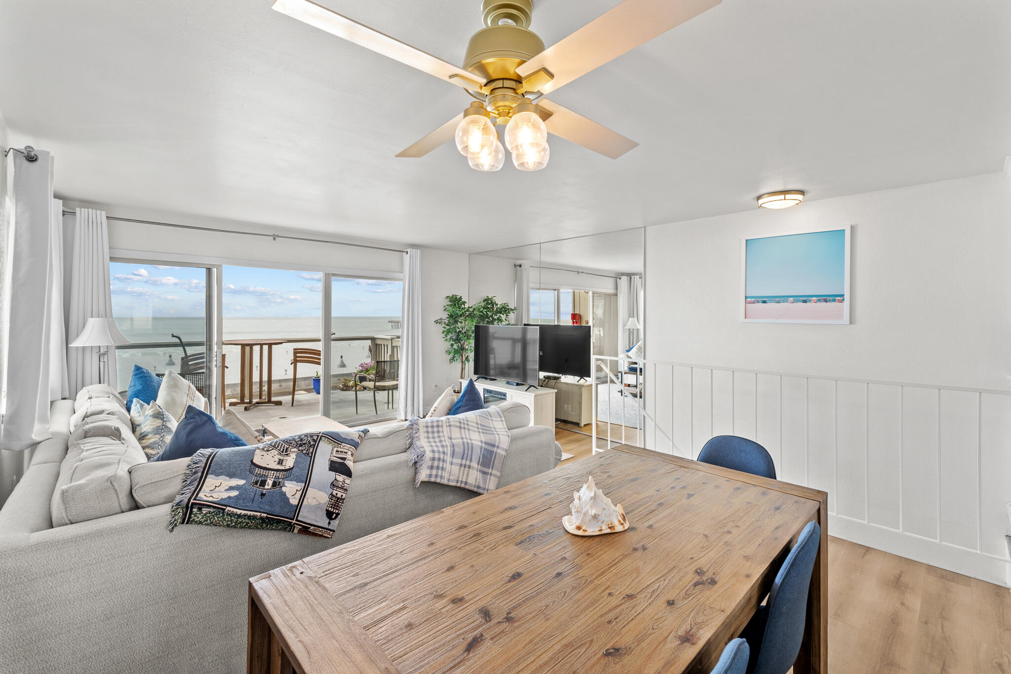 77 North Ocean Avenue, Unit 12 Cayucos, CA 93430 - Photo 20 of 41 a view of a dining room with furniture a chandelier and large windows