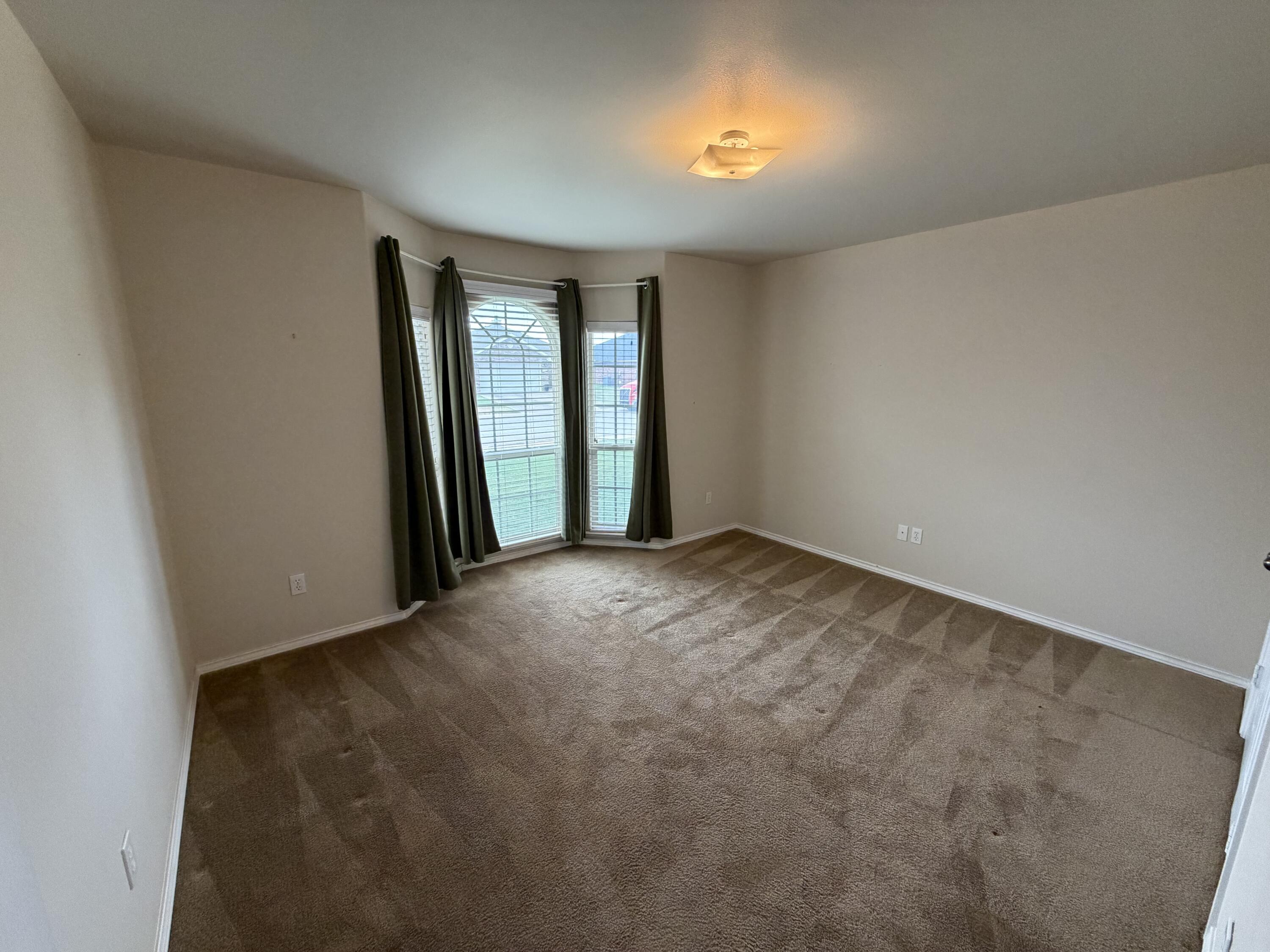 6544 84th Street Lubbock, TX 79424 - Photo 25 of 29 an empty room with windows and closet
