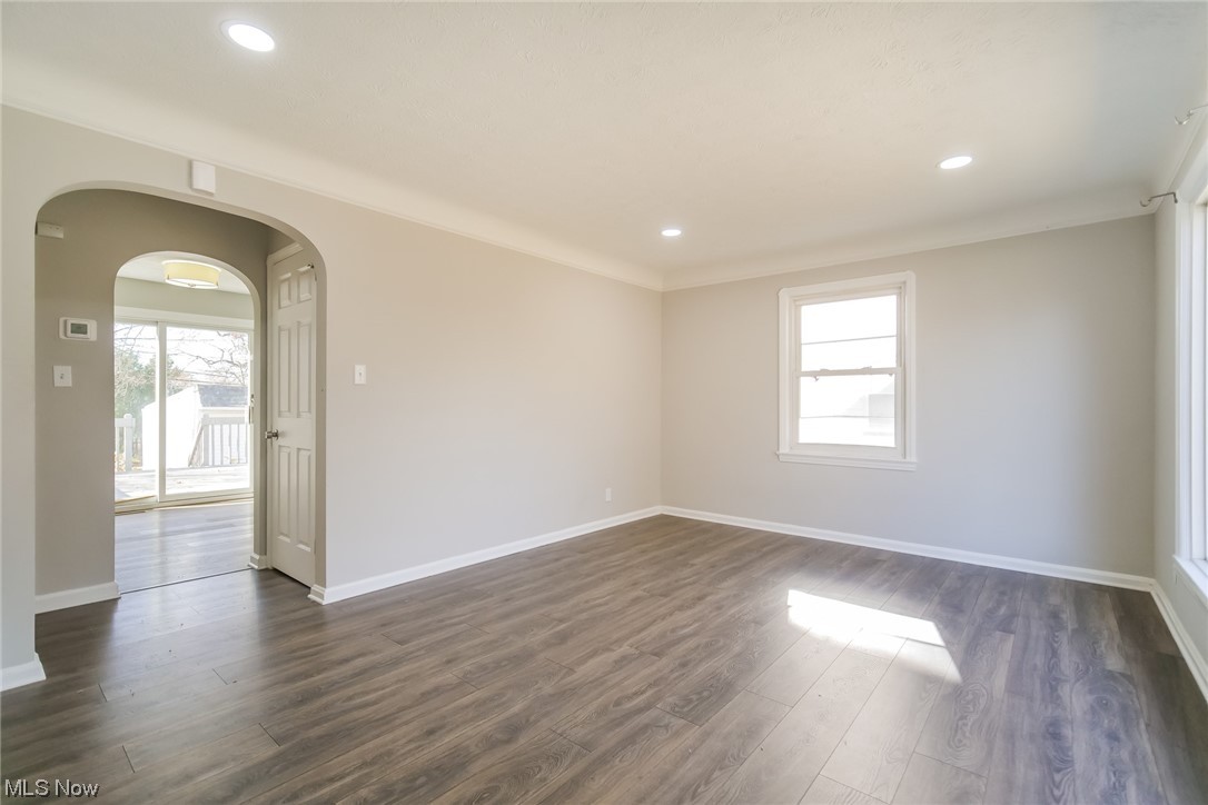 1668 Winchester Road Cleveland, OH 44124 - Photo 4 of 20 Unfurnished room featuring ornamental molding and dark hardwood / wood-style floors