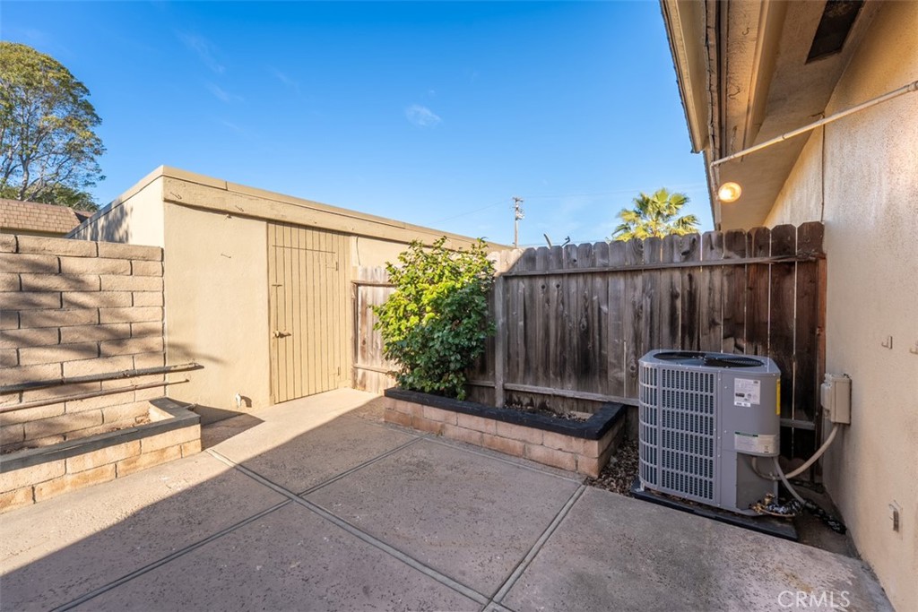 10454 Rio Grande Court Fountain Valley, CA 92708 - Photo 16 of 17 a view of a backyard with wooden fence