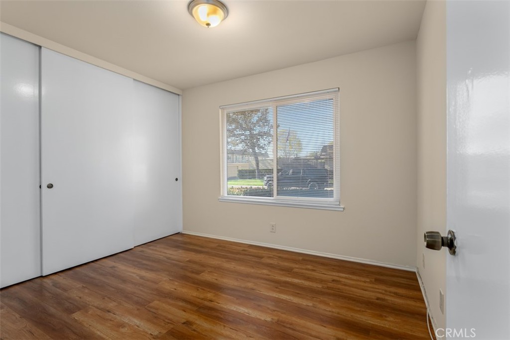 10454 Rio Grande Court Fountain Valley, CA 92708 - Photo 9 of 17 a view of an empty room with wooden floor and a window