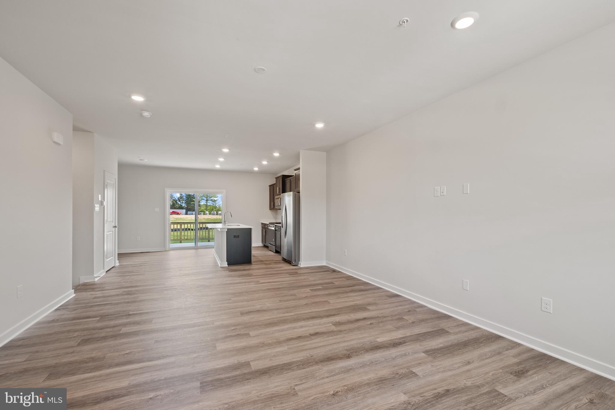 5044 Silver Oak Drive Rosedale, MD 21237 - Photo 11 of 33 a view of a kitchen with a sink and an empty room