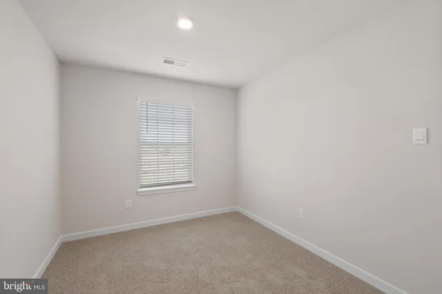 a view of a window in an empty room