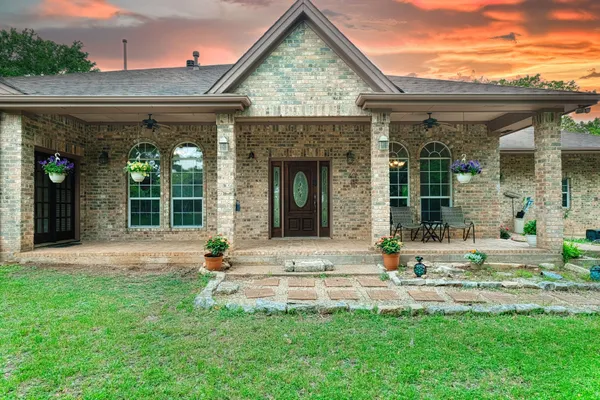 front view of a house with a yard