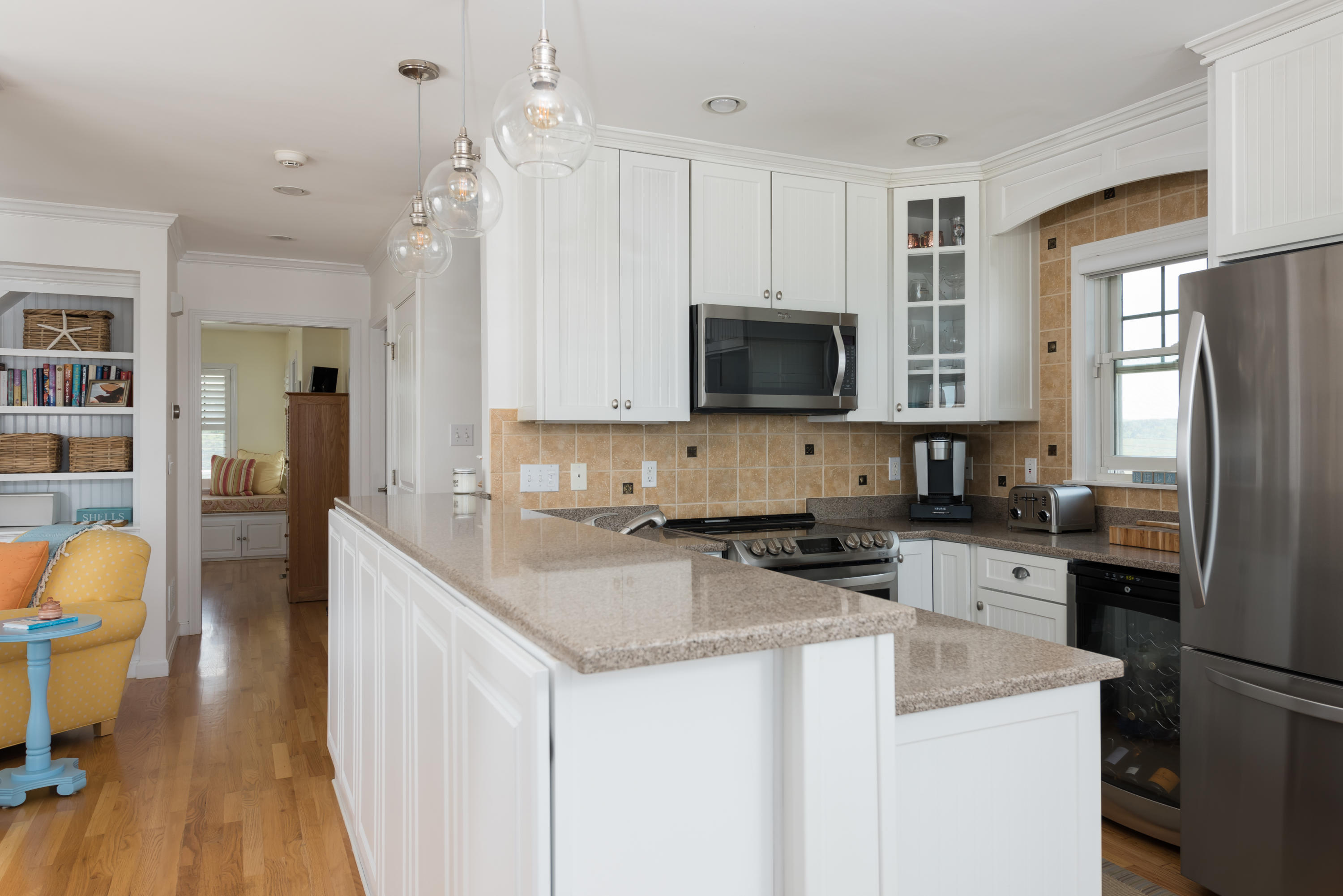 26 Salt Marsh Road East Sandwich, MA 02537 - Photo 11 of 31 a kitchen with a sink a stove a refrigerator a center island and a refrigerator