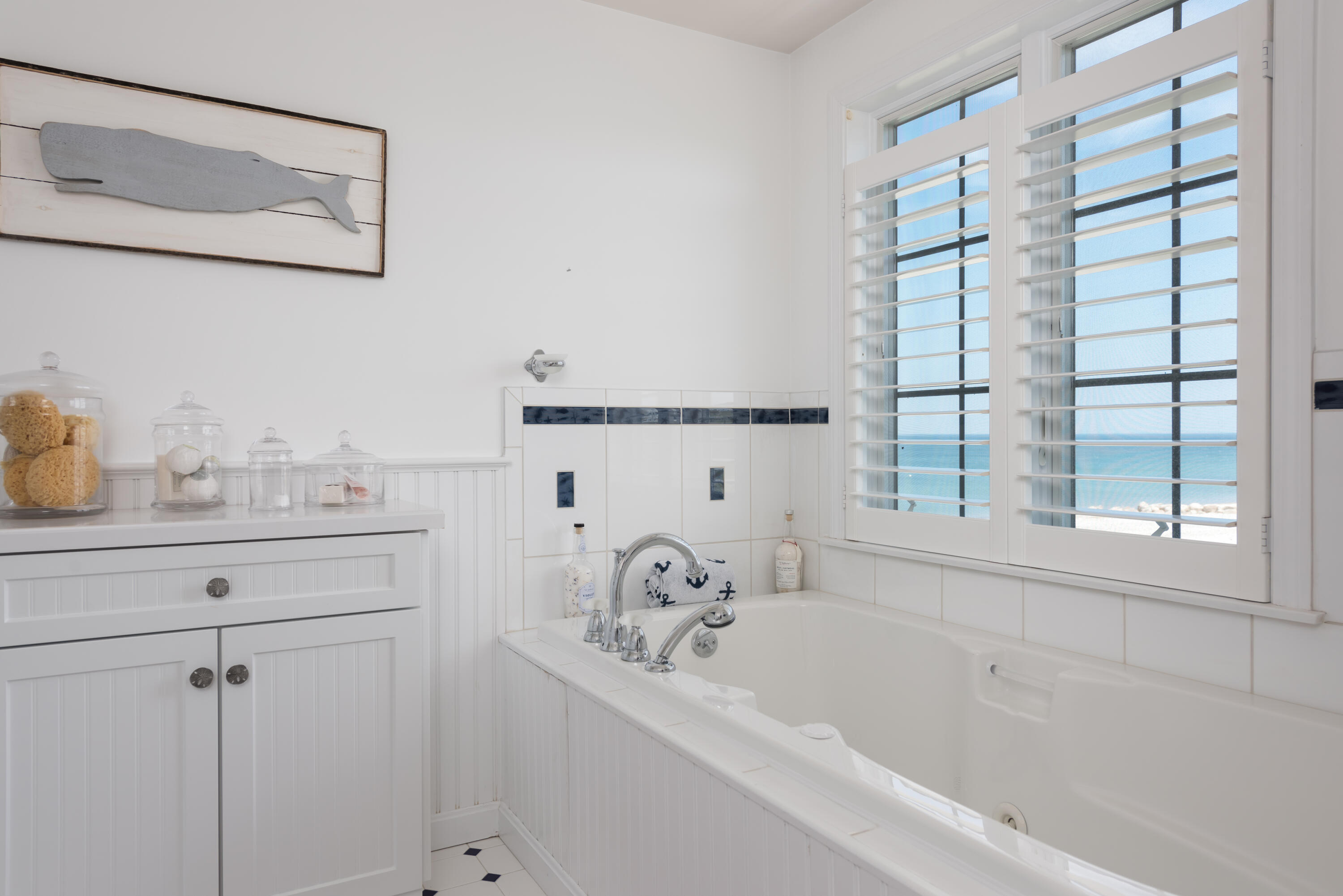 26 Salt Marsh Road East Sandwich, MA 02537 - Photo 20 of 31 a bathroom with a bathtub and a window