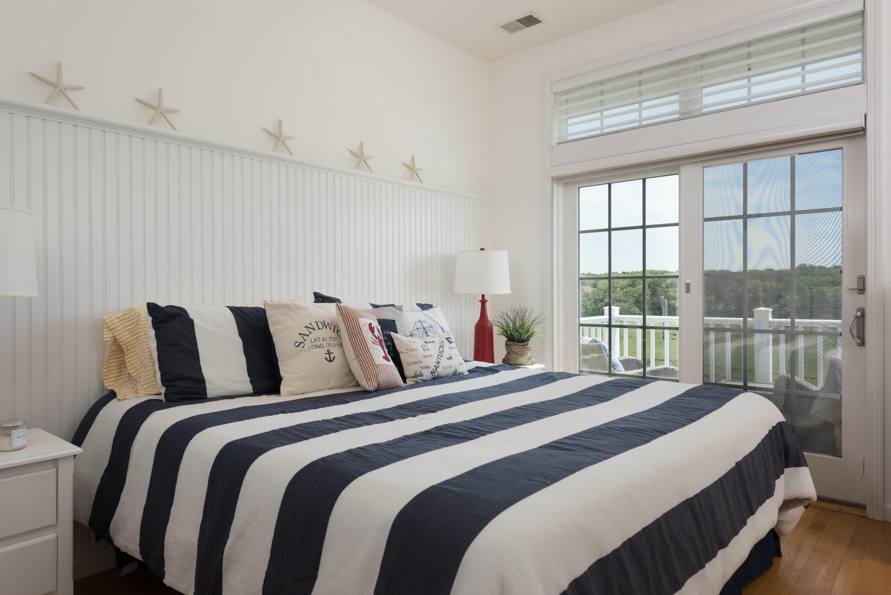 26 Salt Marsh Road East Sandwich, MA 02537 - Photo 21 of 31 a bedroom with a bed and a large window