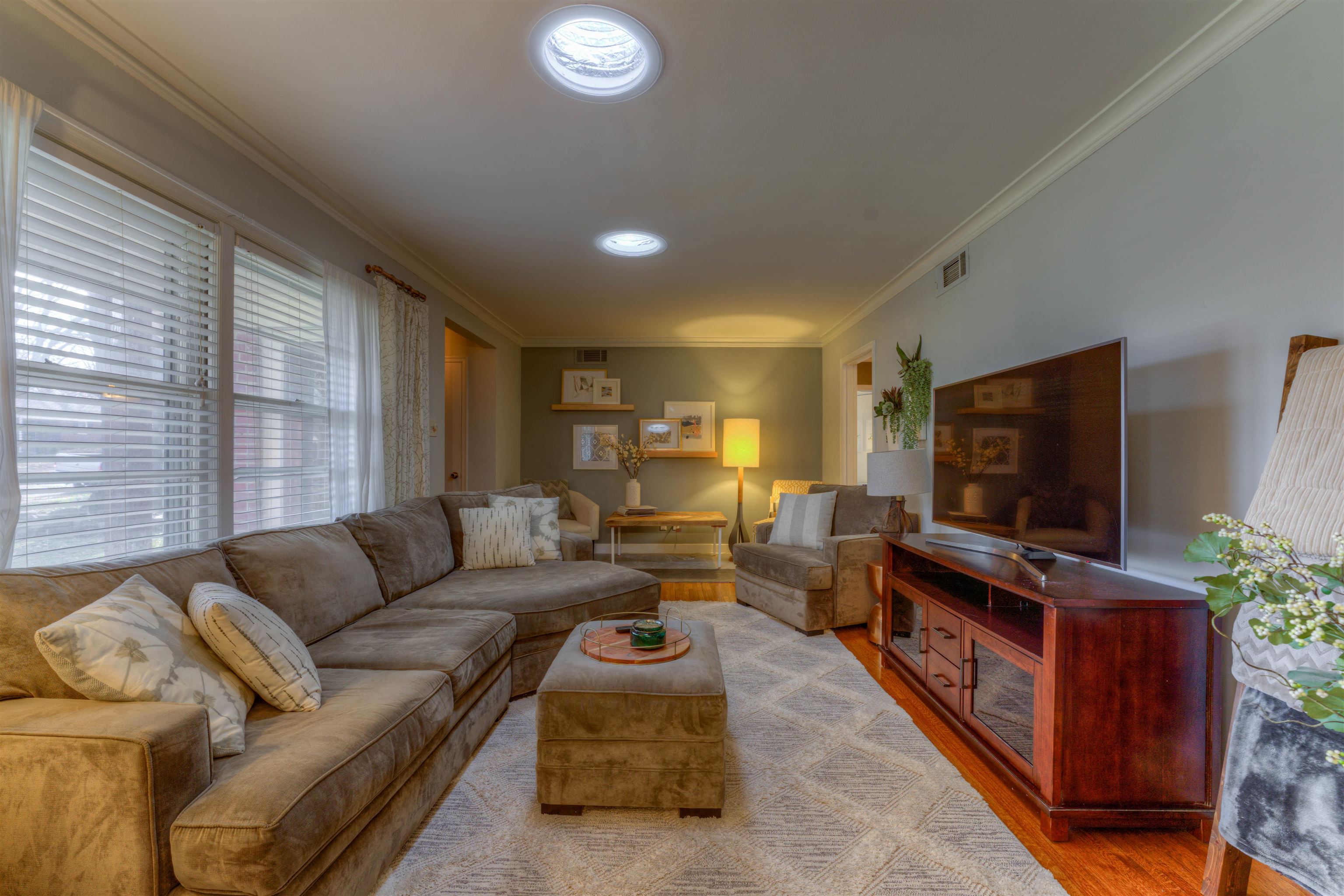 1083 Marcia Road Memphis, TN 38117 - Photo 2 of 11 a living room with furniture and a flat screen tv