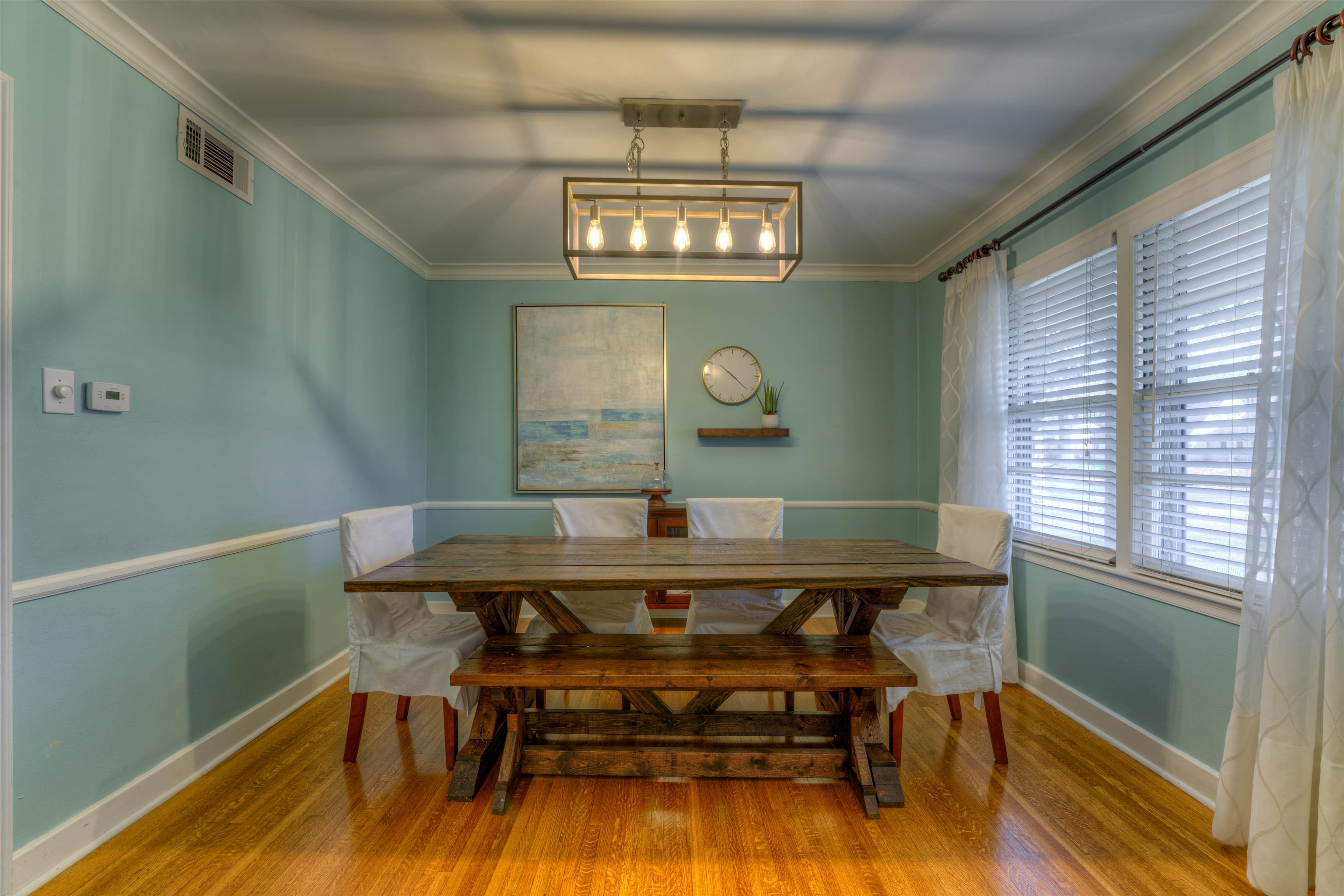 1083 Marcia Road Memphis, TN 38117 - Photo 4 of 11 a view of a dining room with furniture a chandelier and wooden floor