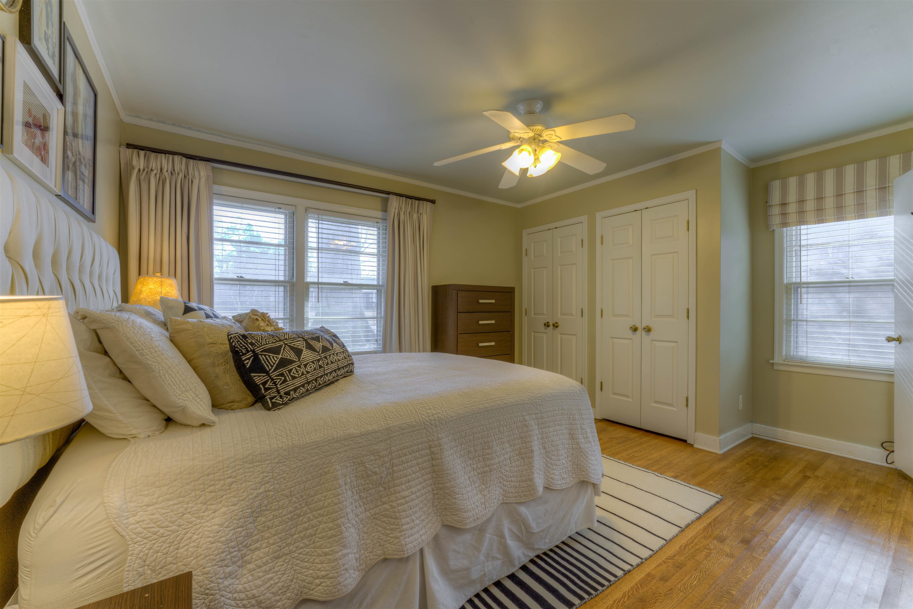 1083 Marcia Road Memphis, TN 38117 - Photo 8 of 11 a bedroom with a bed and wooden floor