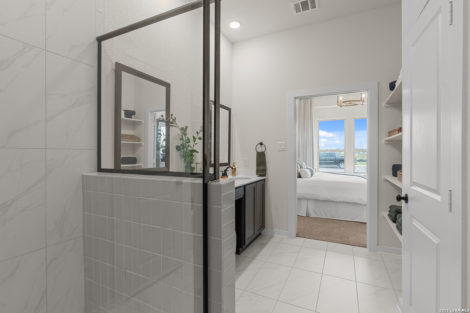 9435 Hidden Stone Schertz, TX 78154 - Photo 12 of 41 a bathroom with a granite countertop sink and mirror