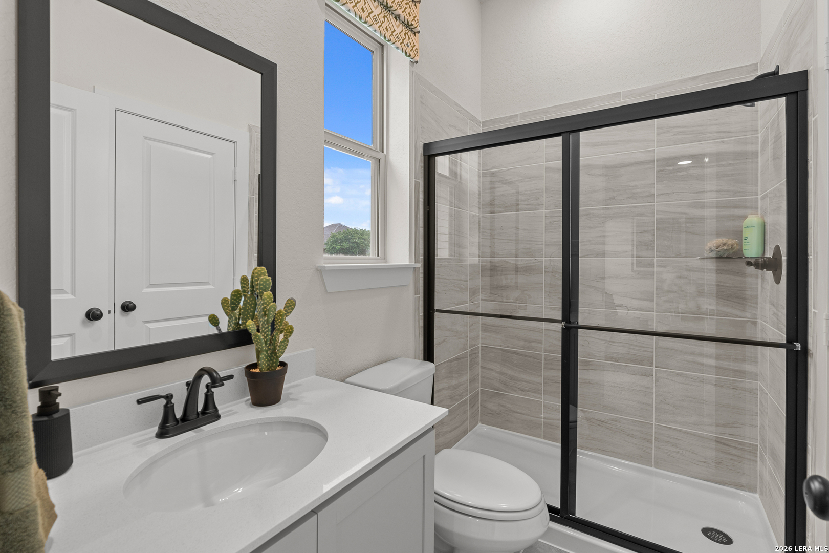 9435 Hidden Stone Schertz, TX 78154 - Photo 30 of 41 a bathroom with a sink toilet and shower