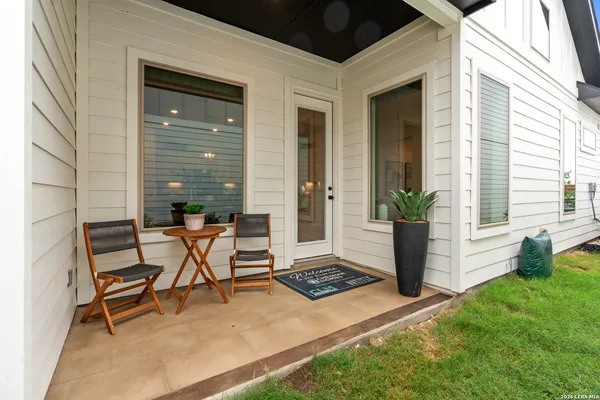 a view of a backyard with furniture
