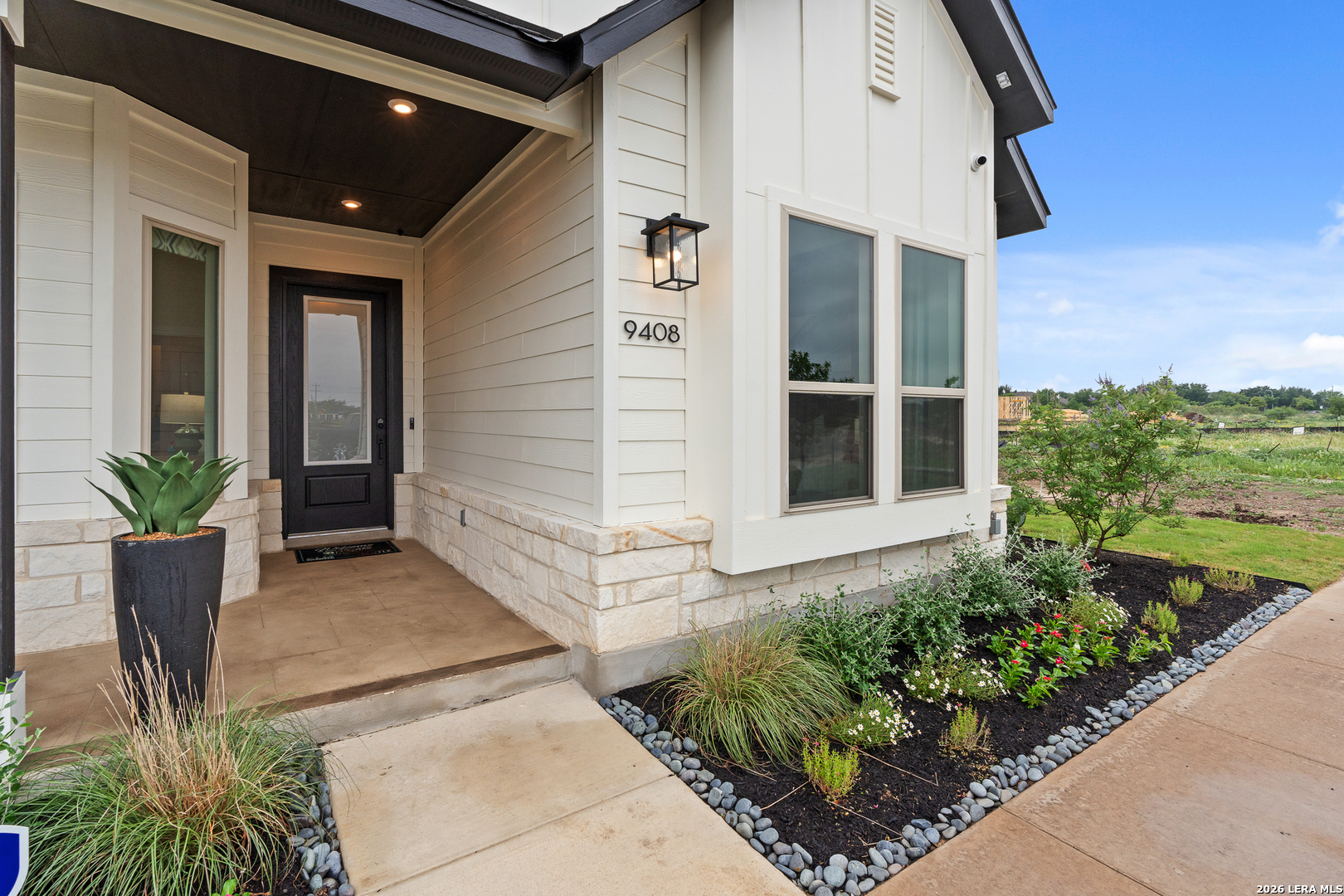9435 Hidden Stone Schertz, TX 78154 - Photo 4 of 41 a front view of a house with a yard