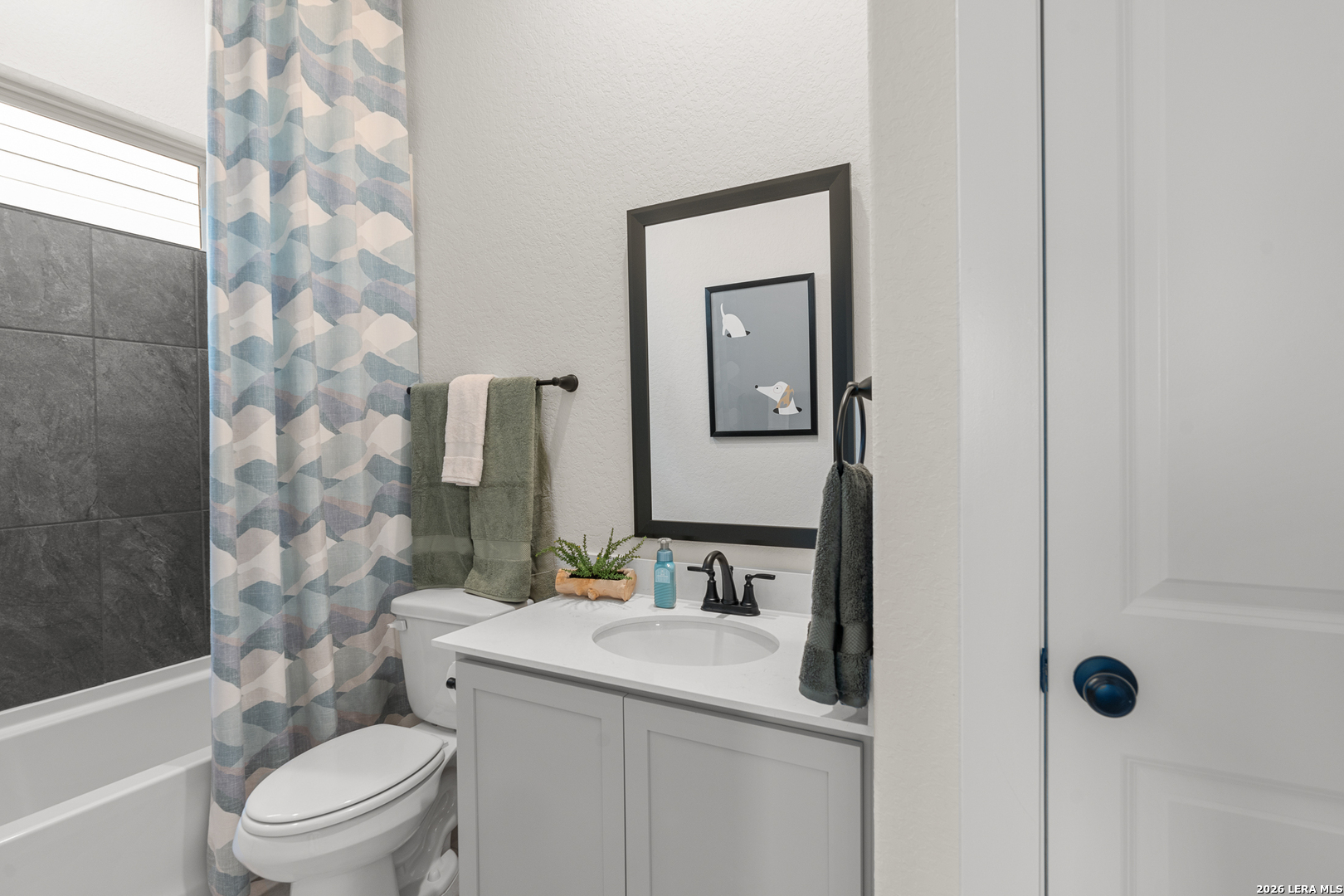 9435 Hidden Stone Schertz, TX 78154 - Photo 8 of 41 a bathroom with a sink toilet vanity and shower