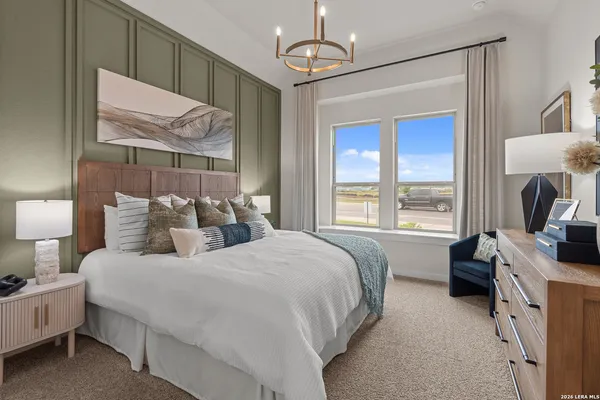 a bedroom with bed and a window