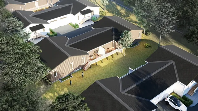 an aerial view of a house with a yard