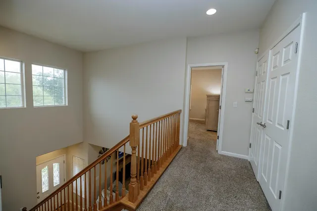 a view of a hallway with windows