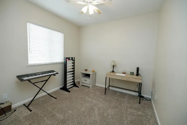 a living room with furniture and a window