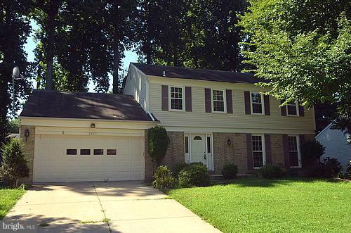 2207 Aventurine Way Silver Spring, MD 20904 - Photo 27 of 27 a front view of a house with a yard and garage