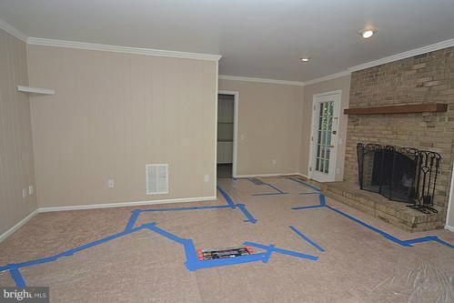 2207 Aventurine Way Silver Spring, MD 20904 - Photo 6 of 27 a room with a fireplace and a rug