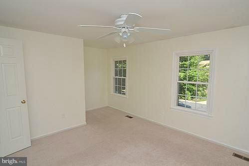 2207 Aventurine Way Silver Spring, MD 20904 - Photo 8 of 27 an empty room with a window and a fan