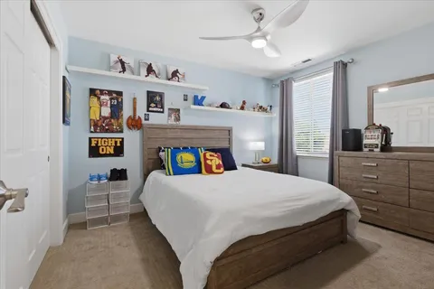 a bedroom with a bed and cabinets