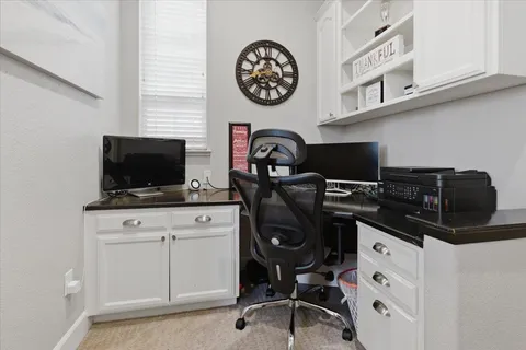 a view of a workspace with furniture