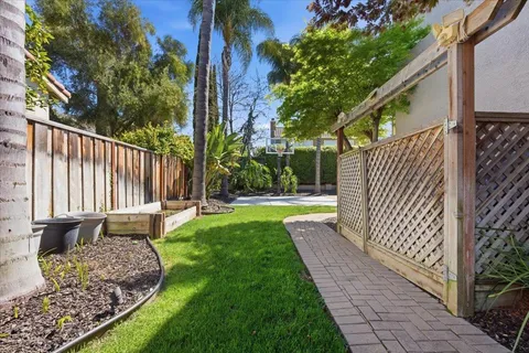 a building outdoor space with patio furniture and potted plants