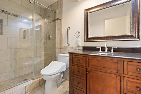 a bathroom with a toilet sink and shower