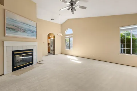 a view of empty room with a fireplace