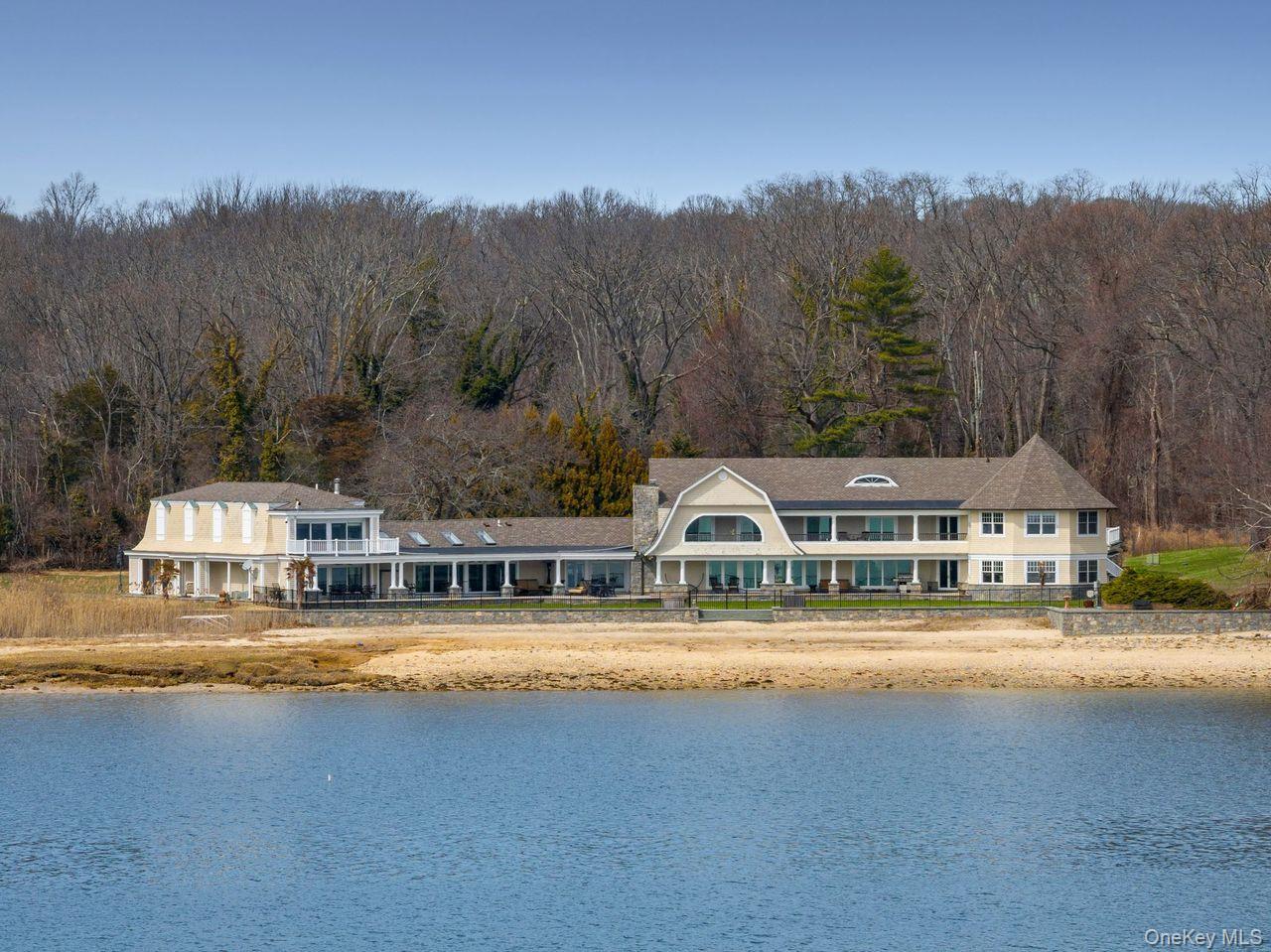 33 Beach Road Northport, NY 11768 - Photo 2 of 50 a view of a city street and trees in the background