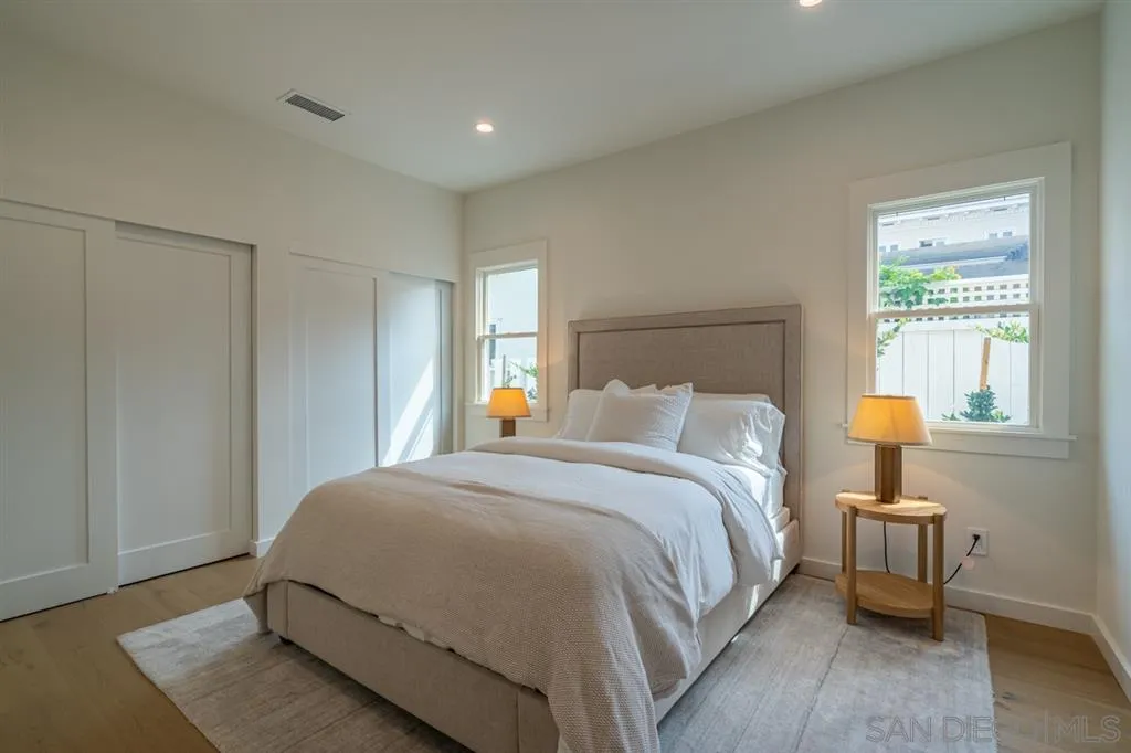 370 Glorietta Boulevard Coronado, CA 92118 - Photo 19 of 25 a bedroom with a bed and window