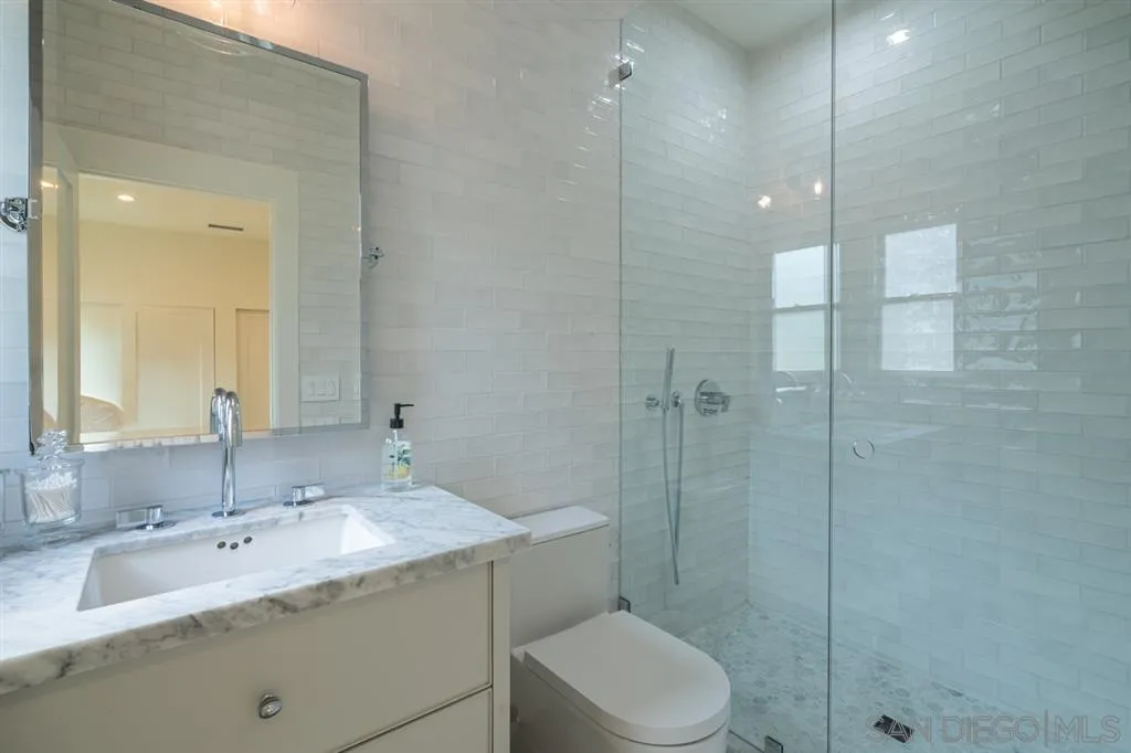 370 Glorietta Boulevard Coronado, CA 92118 - Photo 20 of 25 a bathroom with a sink toilet and shower