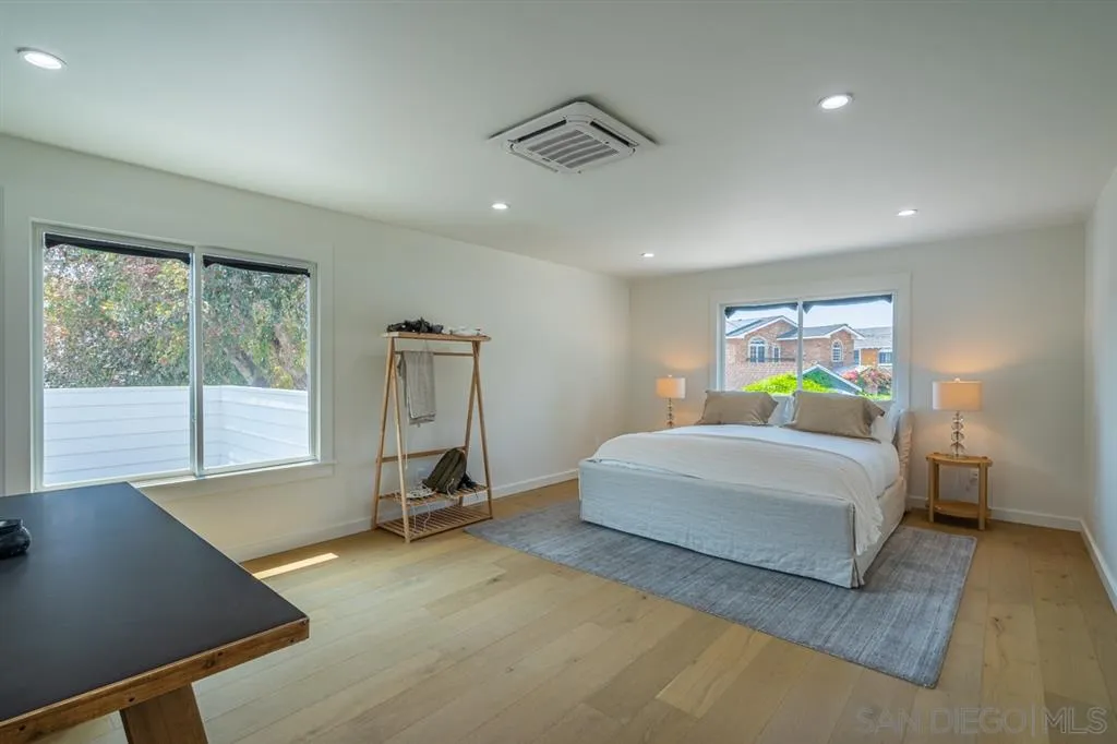370 Glorietta Boulevard Coronado, CA 92118 - Photo 23 of 25 a bedroom with a bed and window