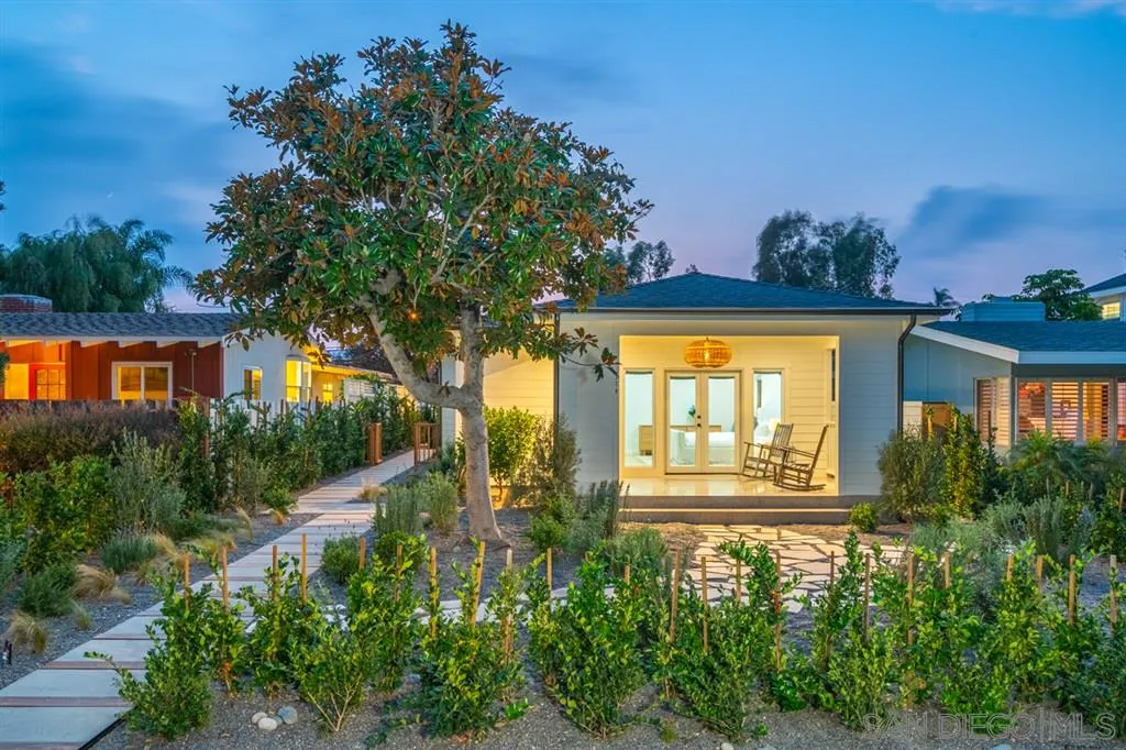 370 Glorietta Boulevard Coronado, CA 92118 - Photo 4 of 25 a view of a house with a small yard and potted plants