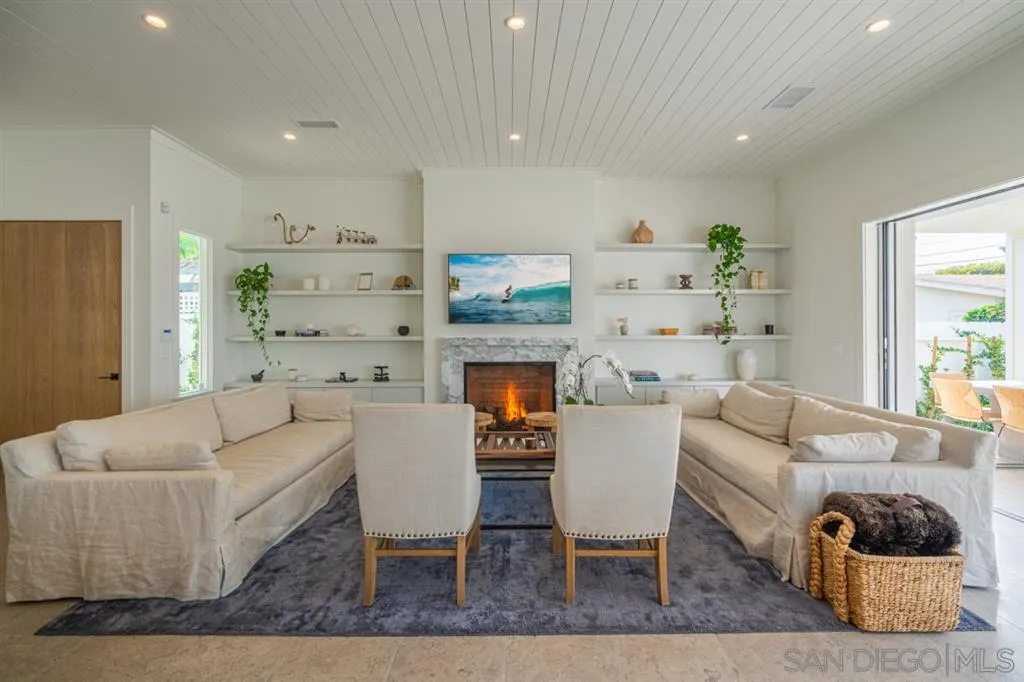 370 Glorietta Boulevard Coronado, CA 92118 - Photo 7 of 25 a living room with furniture and a fireplace